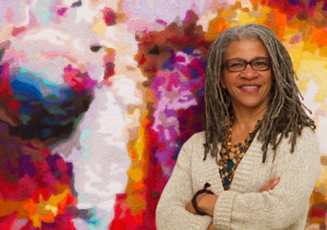 Sidnee Snell with her quilt Deterioration Interrupted (2015).