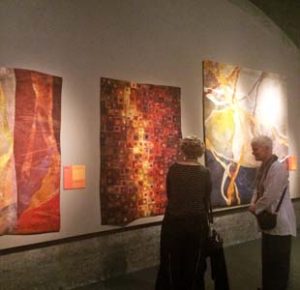 Quilts in the CQA show pictured left to right are Cavern by Bonnie Bucknam, River of Light by Janet Kurjan, and Tumble by Bonnie Bucknam.