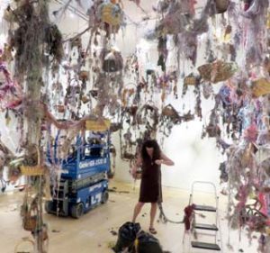 Susan Lenz installing Threads: Gathering My Thoughts (2016) at the Mesa Arts Center near Phoenix, Arizona.